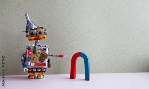 Fotografie Funny robot red blue horseshoe magnet