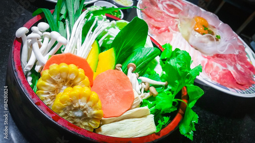 Fresh marinated pork ,beef slices and fresh vegetables with ingredients for cooking grilled BBQ or shabu shabu and Sukiyaki Japanese food , Recommended dishes in Asian cuisine .