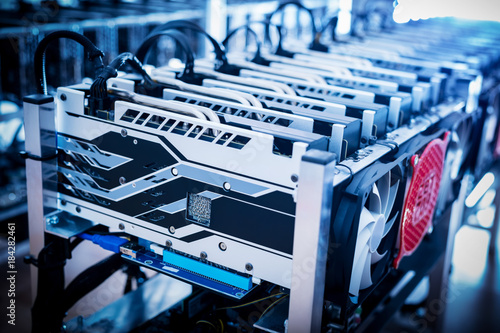 Plakat Bitcoin mining devices standing in a row.
