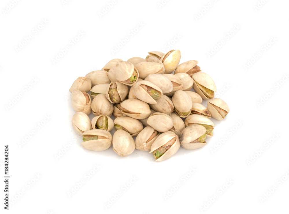 Heap of roasted Pistachio nuts isolated on white background Heap of roasted Pistachio nuts isolated on white background