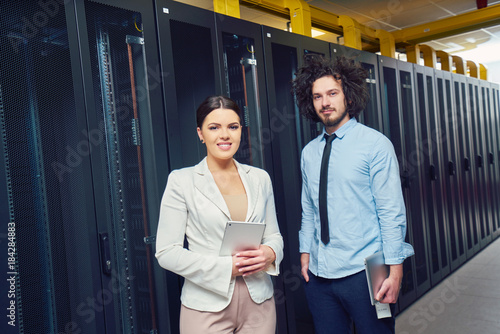 Young couple working at a data center © fotoinfot