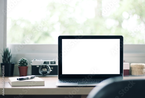 blank screen laptop on the desk at home office,Vintage tone