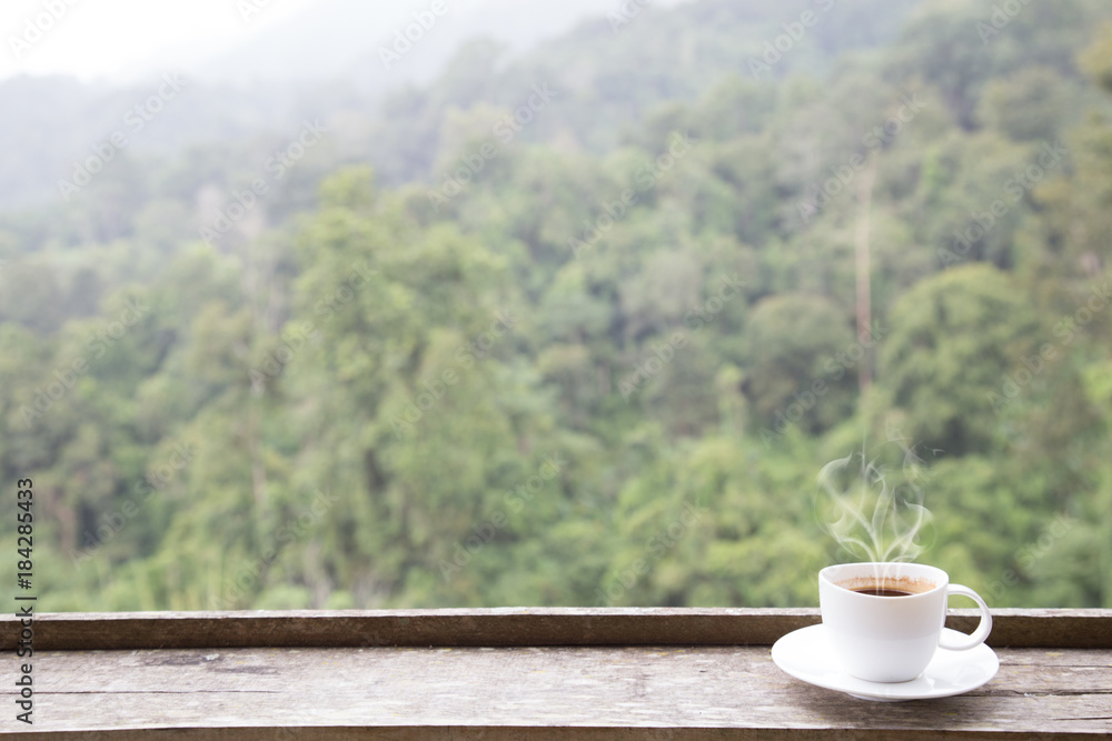 Coffee cup and smoke with copy space background green mountain nature. Coffee cup and smoke with copy space background green mountain nature.