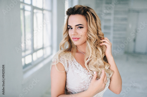 Beauty portrait of bride wearing fashion wedding dress with feathers with luxury delight make-up and hairstyle, studio indoor photo. Young attractive multi-racial Asian Caucasian model. Serious Free Download Beauty portrait of bride wearing fashion wedding dress with feathers with luxury delight make-up and hairstyle, studio indoor photo. Young attractive multi-racial Asian Caucasian model. Serious - GFXLoad