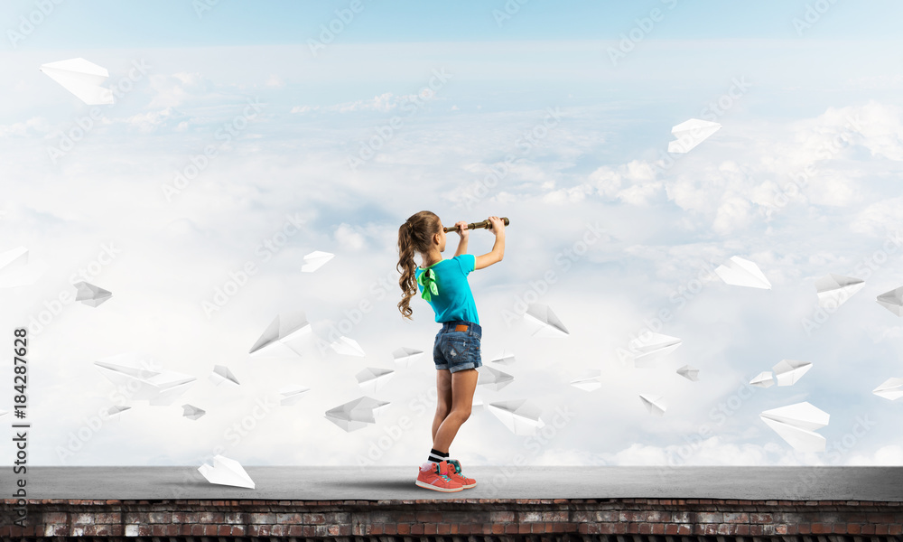 Concept of careless happy childhood with girl exploring this world Concept of careless happy childhood with girl exploring this world