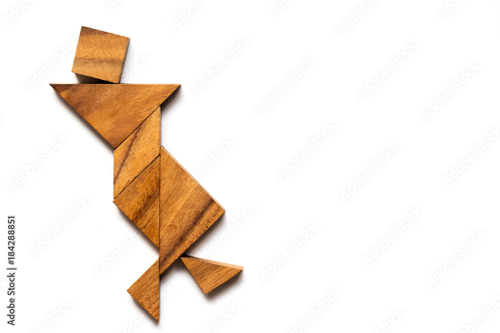 Wood tangram puzzle in danicing man shape on white background (Concept for happiness, joy) Wood tangram puzzle in danicing man shape on white background (Concept for happiness, joy)