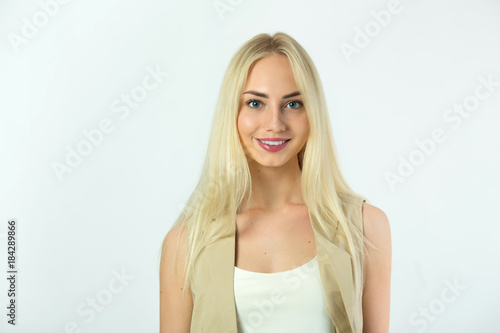 beautiful young modern girl on a white background with a smile on her face