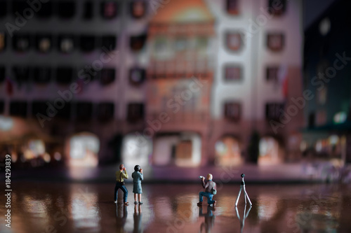 Group of photographers in the Old City of Innsbruck shooting the Golden Roof - miniature figures