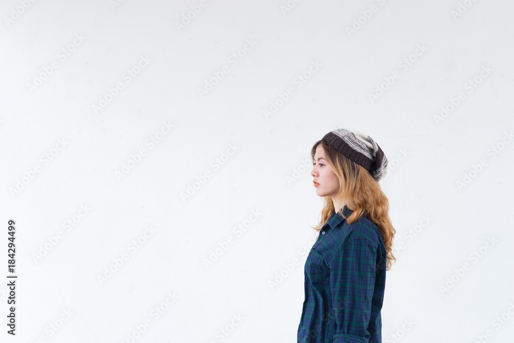 Portrait of hipster girl on white wall,lifestyle of modern teen,Cool hipster woman wear hat,Thailand people pose for take a picture Portrait of hipster girl on white wall,lifestyle of modern teen,Cool hipster woman wear hat,Thailand people pose for take a picture