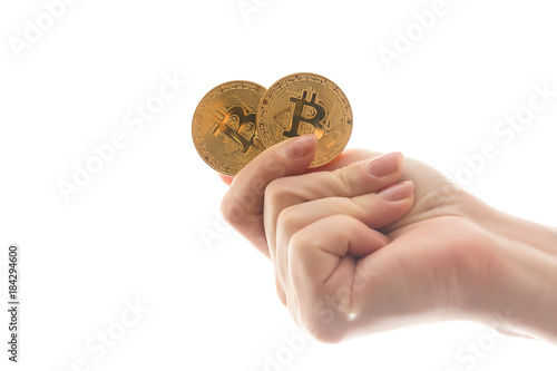 Two golden bitcoin in  hand digitall symbol of a new virtual currency isolated on white photo