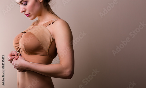 Woman wearing a compressing bra photo