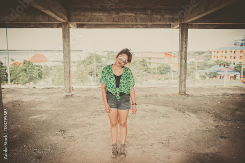 Hipster asian fat woman sit on the floor pose for take a picture vintage style,thailand people