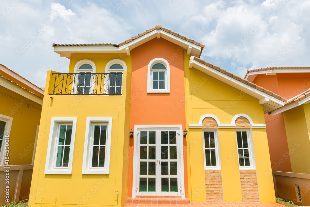 Orange home tuscany style in khaoyai resort at nakhonratchasima,vivid,sunny day,beautiful sky