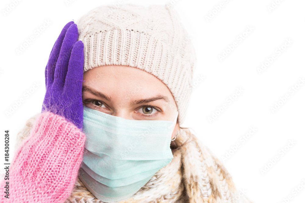 Unwell woman holding her head because of flu virus Unwell woman holding her head because of flu virus