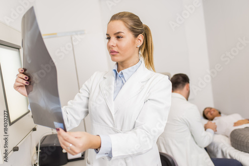 Radiologist lokking at x-ra...
