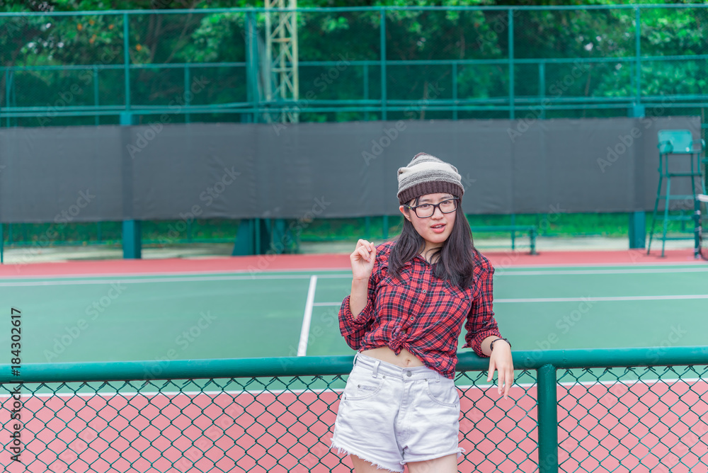 Portrait of asian hipster girl at Tennis Court,Thailand people wear glasses  Stock Photo | Adobe Stock