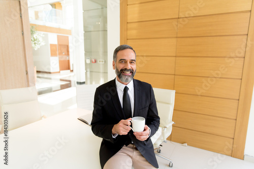 Middle-aged businessman hav...