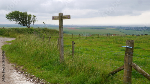 Fingerpost on the South Downs Way with Brighton in the distance