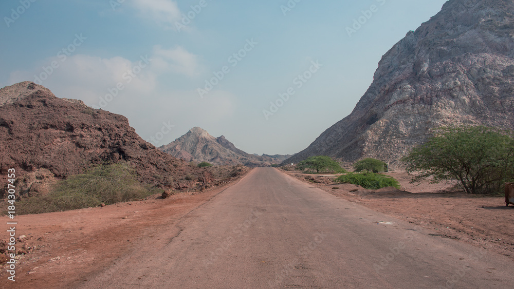 Road through the desert mountains