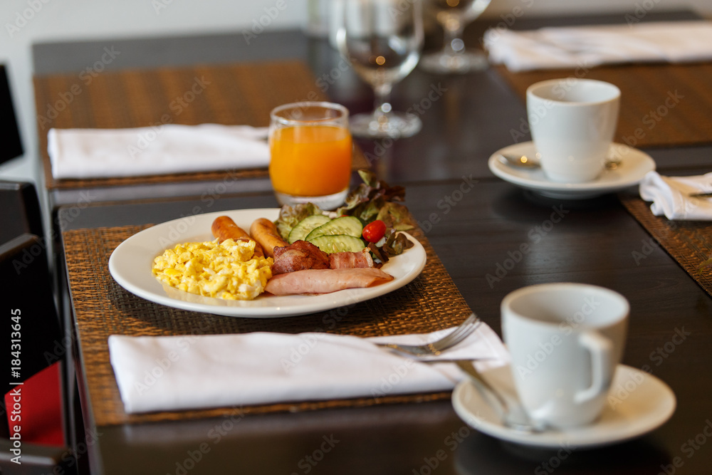 Breakfast served with orange juice and coffee. Breakfast served with orange juice and coffee.