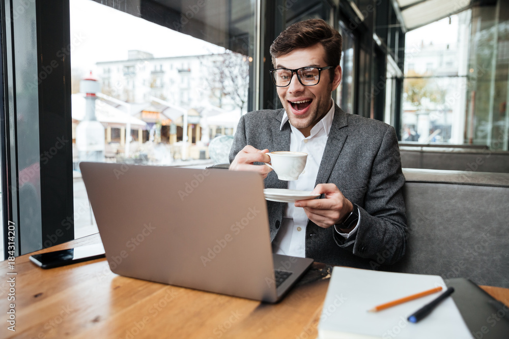 custom made wallpaper toronto digitalLaughing business man in eyeglasses sitting by table in cafe