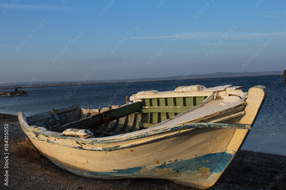 to become older by the sea. abandoned boat. fresh air. long walking in Sand Island in Canakkale in Turkey.