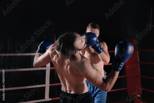 Young professional boxers training in ring © Africa Studio