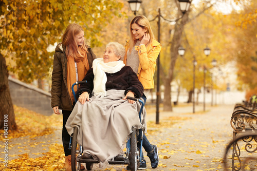Elderly woman in wheelchair...