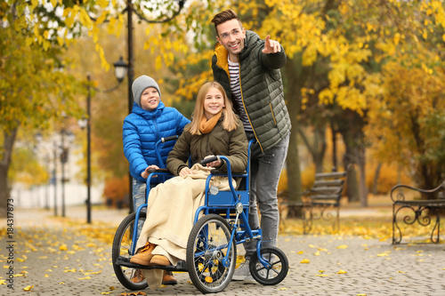 Teenage girl in wheelchair ...