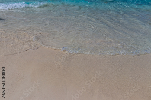 Sea surf on the beach with coral sand. photo