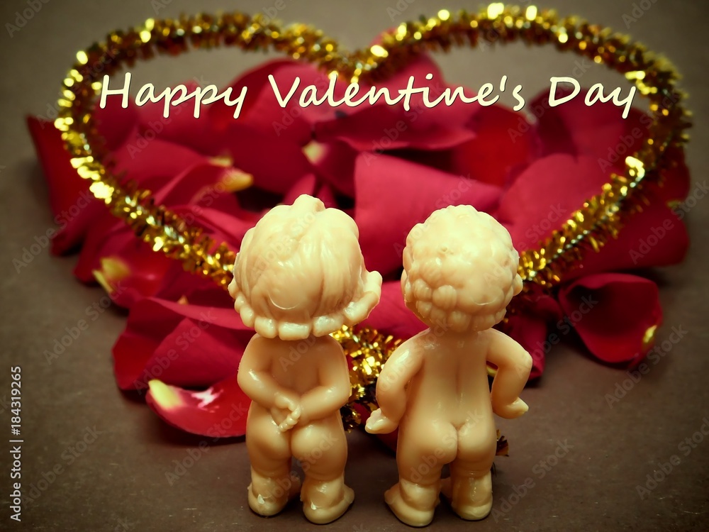 Valentine's day decoration concept-two lovers of dolls on a background with red roses.
