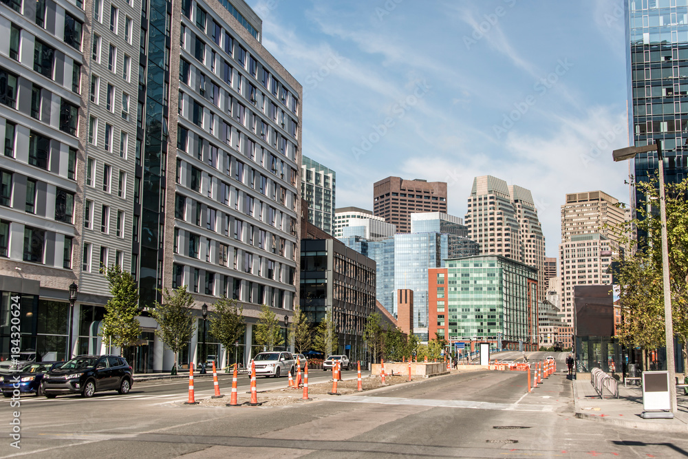 Boston MA USA skyline summer day panoramic view buildings downtown and road with traffic at waterfront side Boston MA USA skyline summer day panoramic view buildings downtown and road with traffic at waterfront side