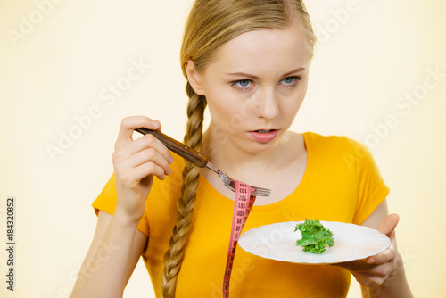 Sad young woman being on diet