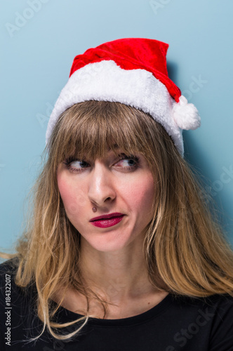 Portrait of a Beautiful blonde girl wearing santa hat