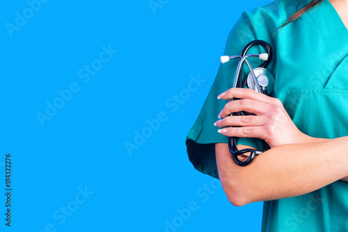Female Doctor holding a stetoschope in her hands
