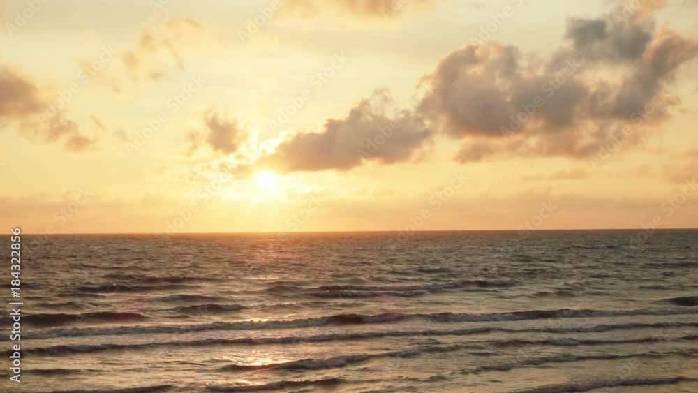 Sunset on the sea with the waves in slow motion Sunset on the sea with the waves in slow motion