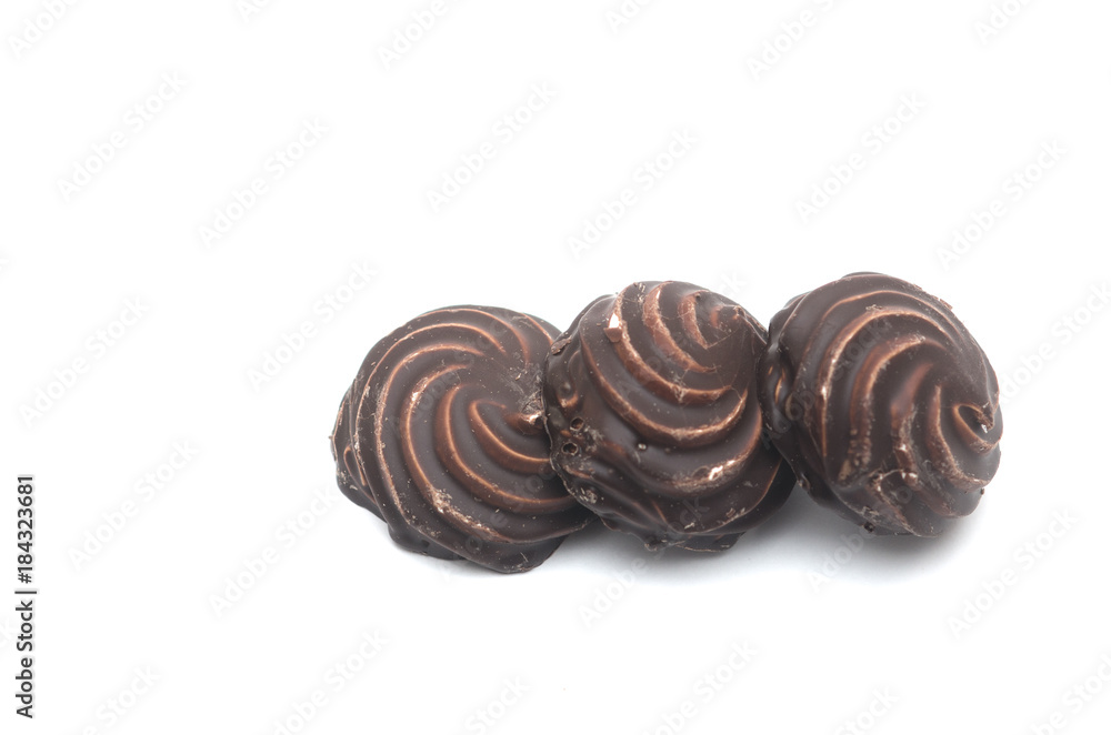 Chocolate covered marshmallows on white background Chocolate covered marshmallows on white background