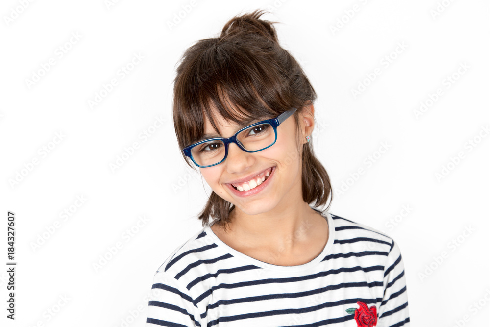 Portrait of a happy little girl with glasses
