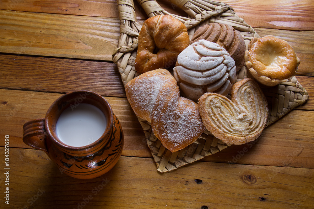 Cup of milk and mexican sweet bread