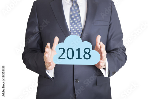 Businessman pressing cloud computing icon with 2018 word written 