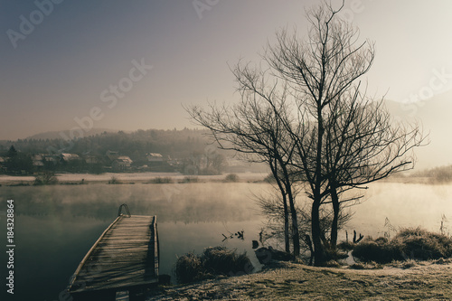Mysterious lake on an early winter morning photographed in backlight in central Slovenia © SVP Productions