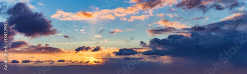 background panorama. rays of the sun make their way through dramatic clouds