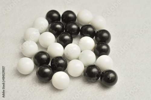 Black and white balls displayed on a white background