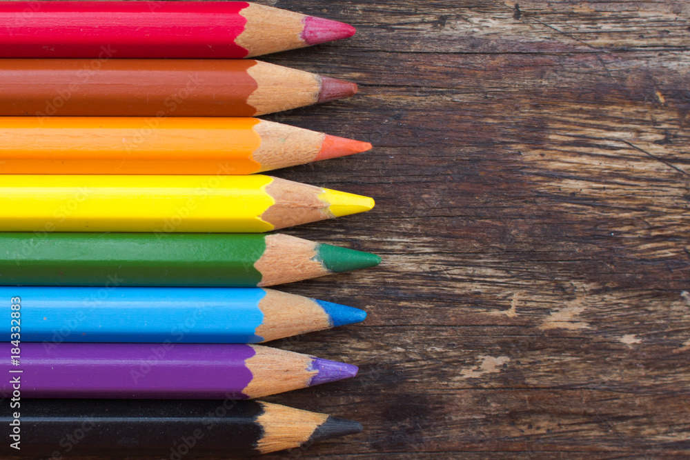 Color pencils on a wooden table Color pencils on a wooden table