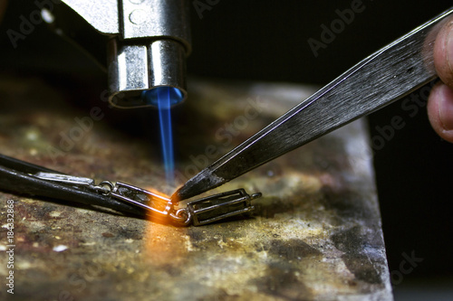 Solder jewelry using burner / Jewelery production. 