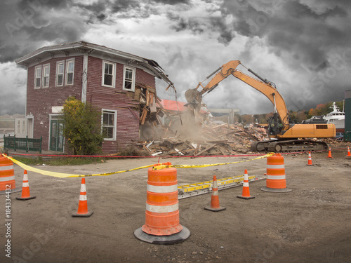 Obraz na plátně demolition of an old house with power shovel
