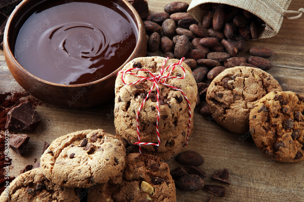 Fototapeta premium Chocolate cookies on wooden table. Chocolate chip cookies.