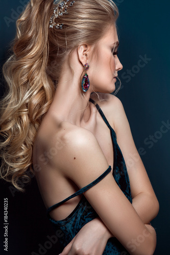 Model blonde Woman with perfect hairstyle and creative hair-dress, side view