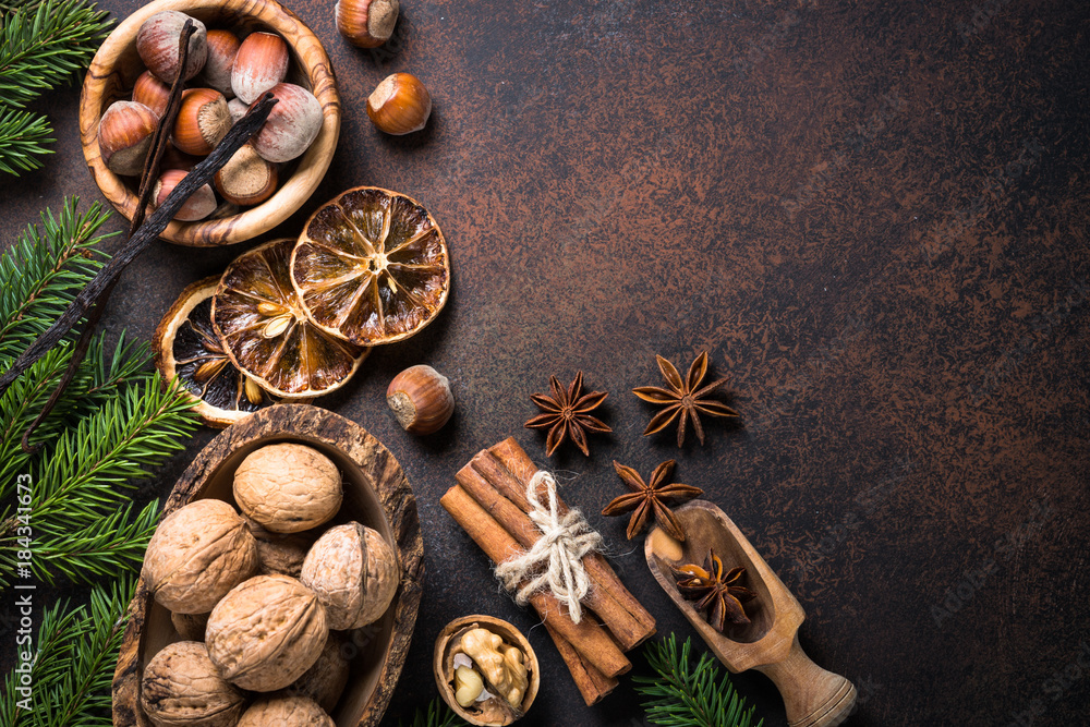 Christmas spices and nuts on rusty stone table. Christmas spices and nuts on rusty stone table.