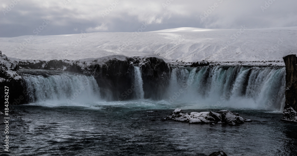 The iconic Goðafoss waterfall in winter, North Iceland The iconic Goðafoss waterfall in winter, North Iceland